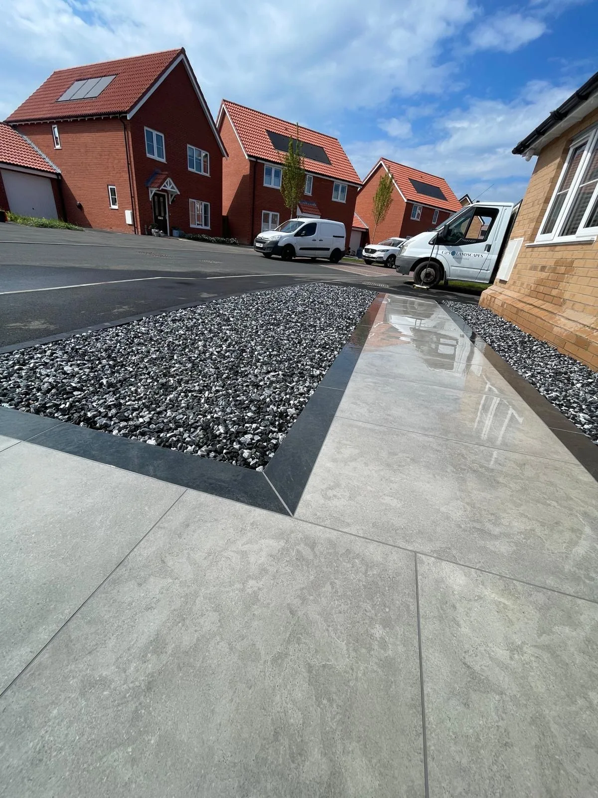 Front garden with paved path and gravel area