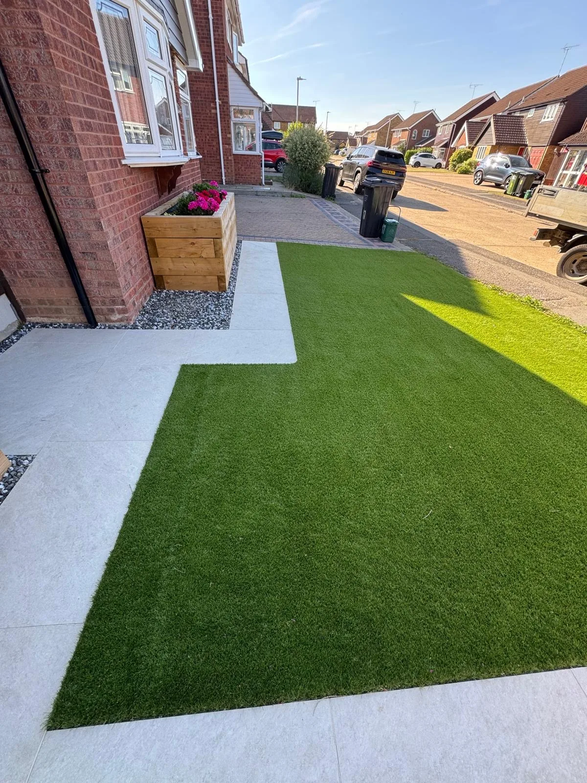 Front garden with artificial lawn and paved path