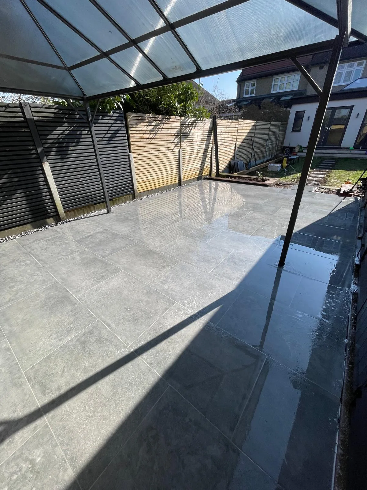 Paved garden area with boundary fencing
